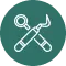 Crossed wrench and screwdriver icon inside a blue circle.